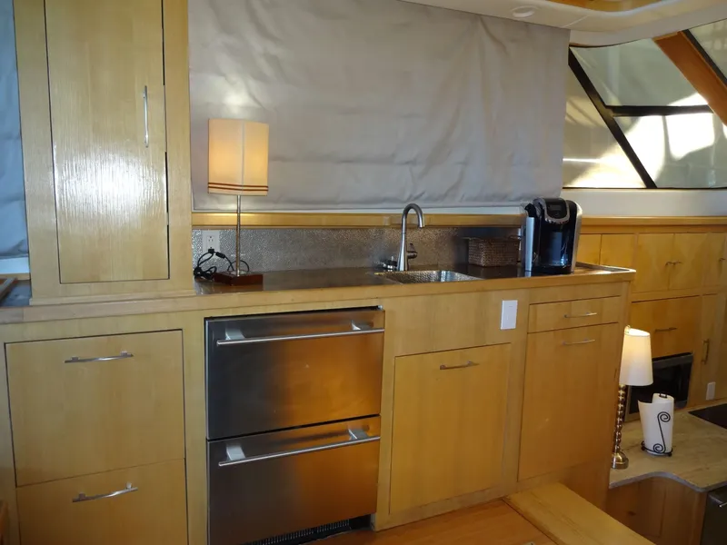 Slide: The Image of Luxurious yacht kitchen with wooden cabinets and modern appliances, President 545, year 1996. - 35
