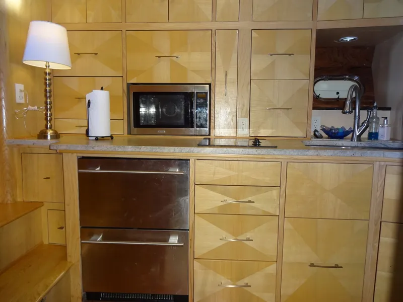 Slide: The Image of Modern kitchen with wooden cabinets and stainless steel appliances, President 545, year 1996. - 36