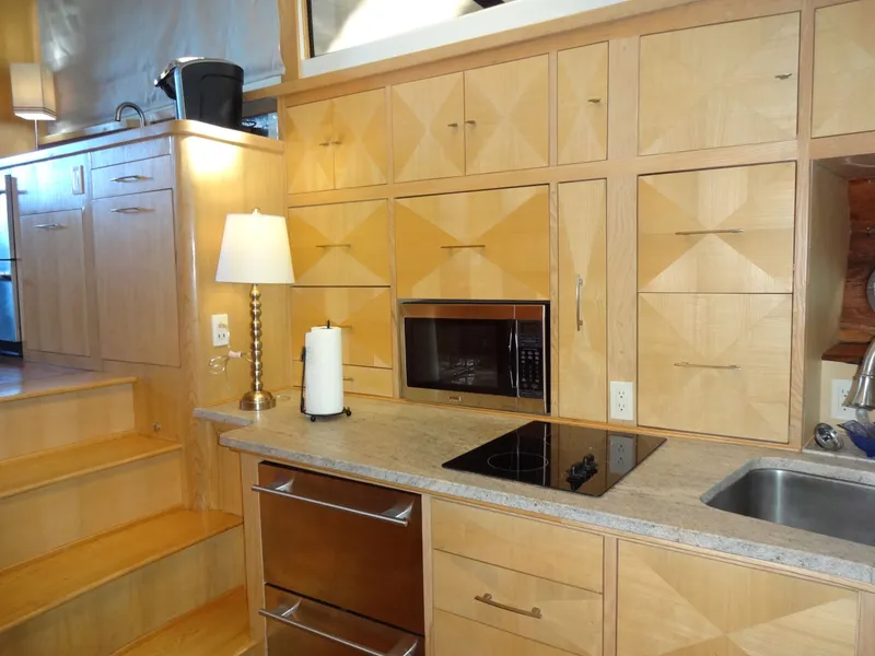 Slide: The Image of Modern kitchen with wooden cabinets and electric stove, President 545, year 1996. - 37