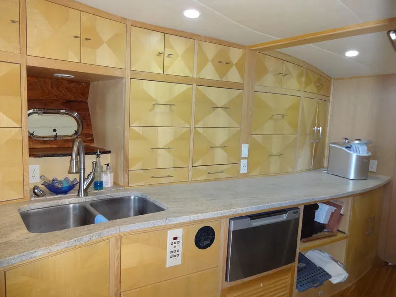 Slide: The Image of Luxurious yacht kitchen with wooden cabinets and stainless steel sink, President 545, year 1996. - 38
