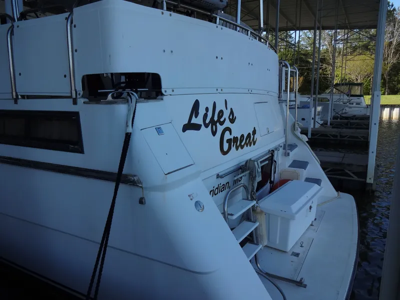 Slide: The Image of 1996 President 545 yacht with "Life's Great" lettering on the stern. - 4