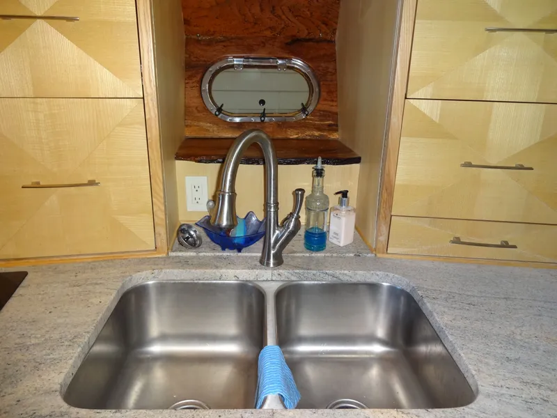 Slide: The Image of Kitchen sink with stainless steel basin and modern faucet, President 545, 1996. - 49