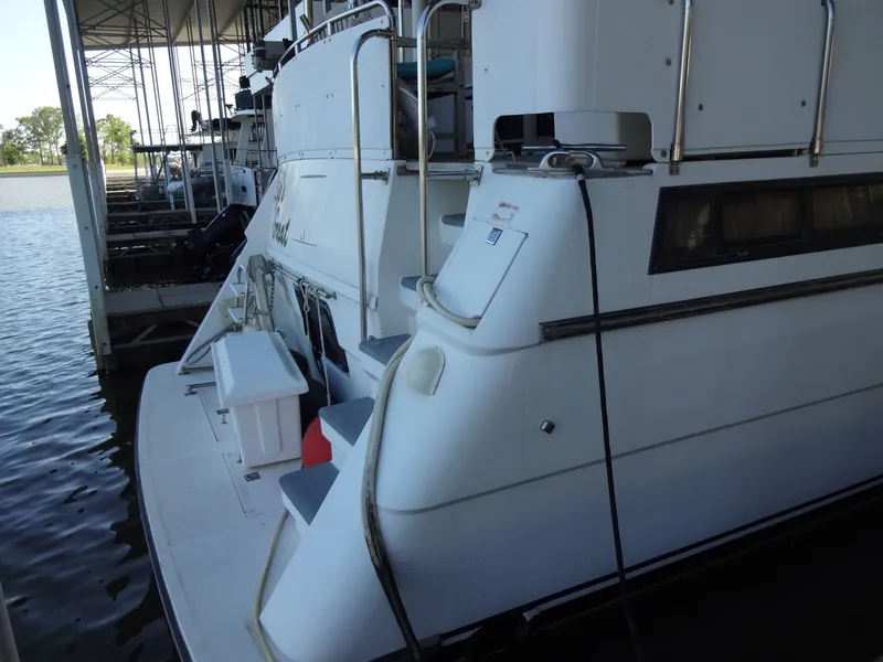 Slide: The Image of 1996 President 545 yacht docked at marina. - 6