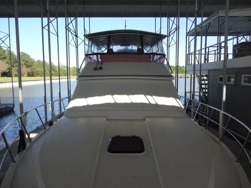 Slide: The Image of 1996 President 545 yacht docked, front view. - 8