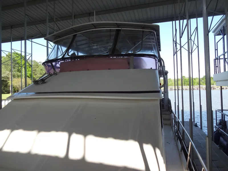 Slide: The Image of 1996 President 545 yacht docked, side view. - 9