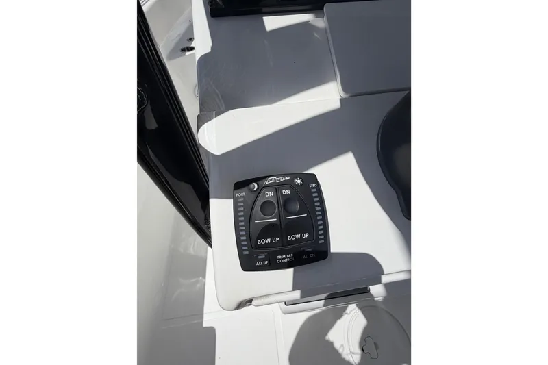Slide: The Image of Trim tab control panel on 2023 Sea Hunt Ultra 234 boat. - 18