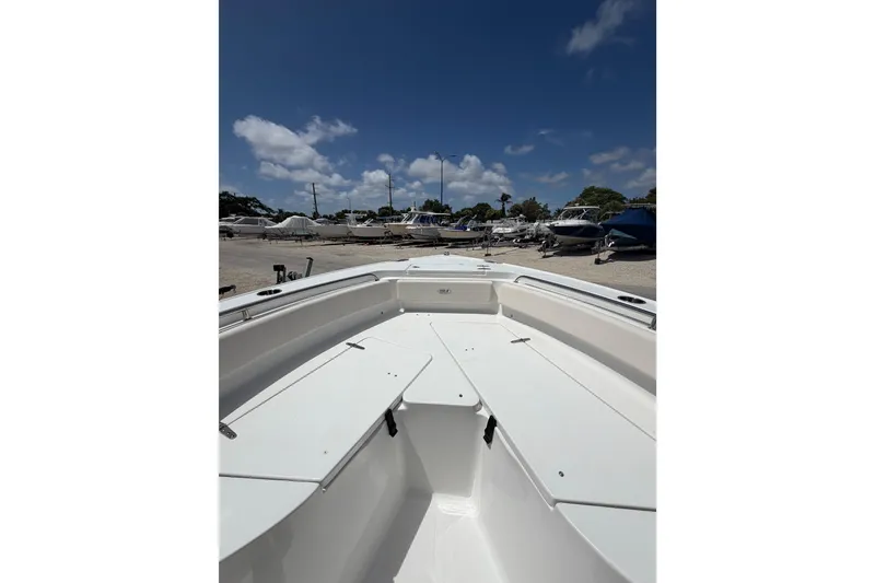 Slide: The Image of 2023 Sea Hunt Ultra 234 boat interior with clear sky background. - 7