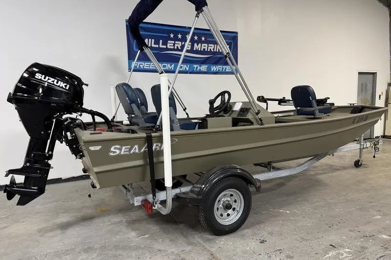 Slide: The Image of 2026 SeaArk 1648 MV Special boat with Suzuki outboard motor on trailer. - 3