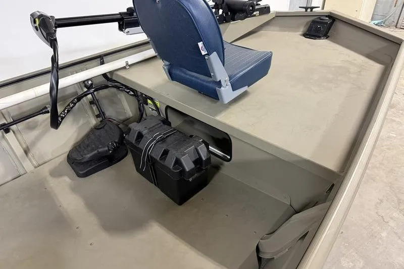 Slide: The Image of 2026 SeaArk 1648 MV Special boat interior with blue seat and storage compartment. - 9