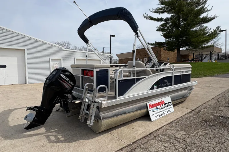 Slide: The Image of 2018 Bennington 188 SL pontoon boat with Mercury outboard motor, parked at Hennepin Marine. - 1