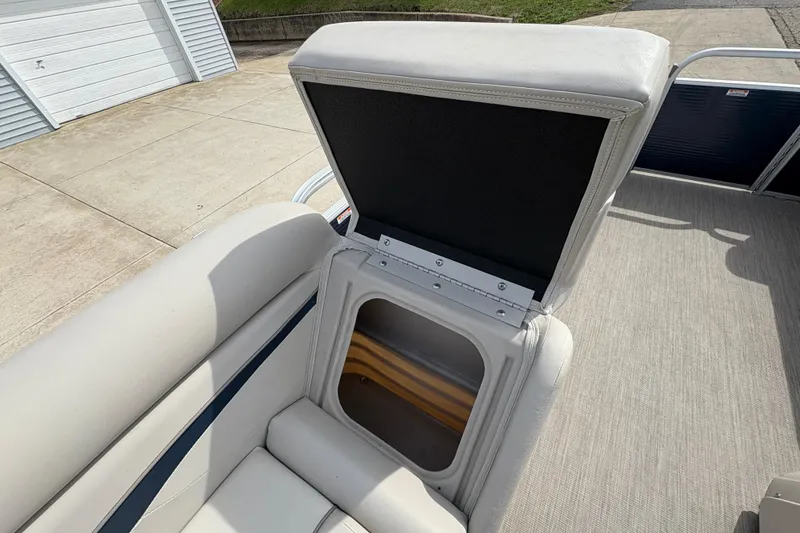 Slide: The Image of 2018 Bennington 188 SL boat with open storage compartment on deck. - 14