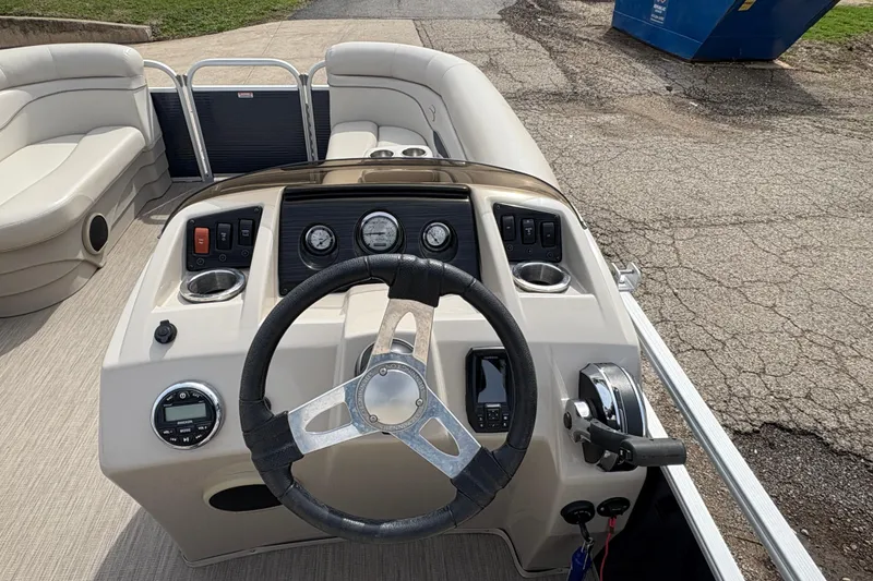 Slide: The Image of 2018 Bennington 188 SL boat dashboard with steering wheel and control panel. - 17