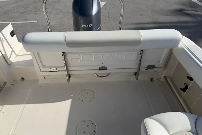 Slide: The Image of 2016 Robalo R227 Dual Console boat interior with Yamaha 200 engine. - 12
