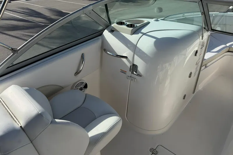 Slide: The Image of 2016 Robalo R227 Dual Console interior with white seating and console details. - 14