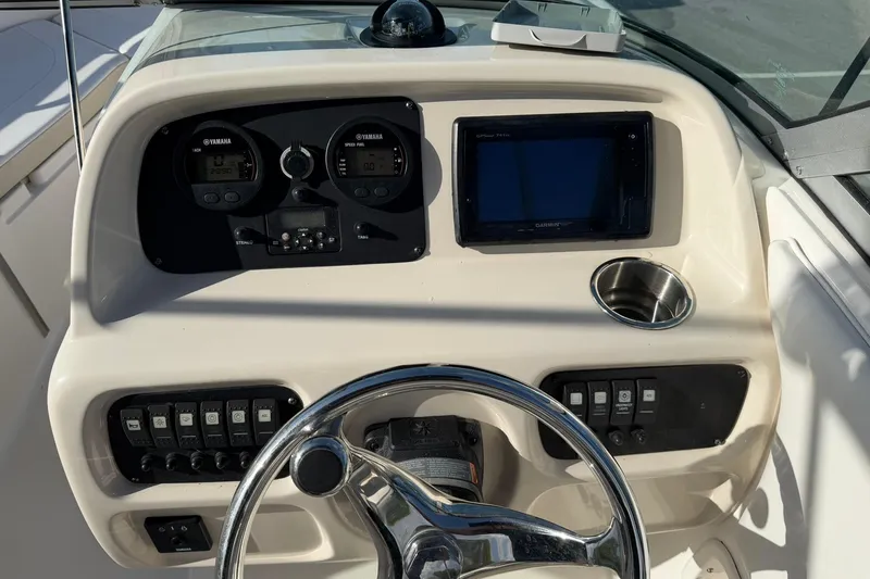 Slide: The Image of 2016 Robalo R227 Dual Console dashboard with Yamaha gauges and Garmin GPS. - 17