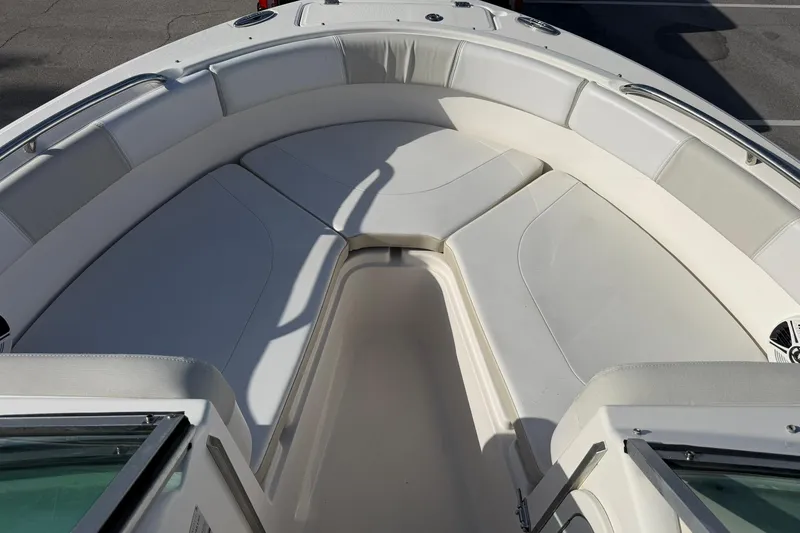 Slide: The Image of 2016 Robalo R227 Dual Console boat with spacious, cushioned seating area. - 19
