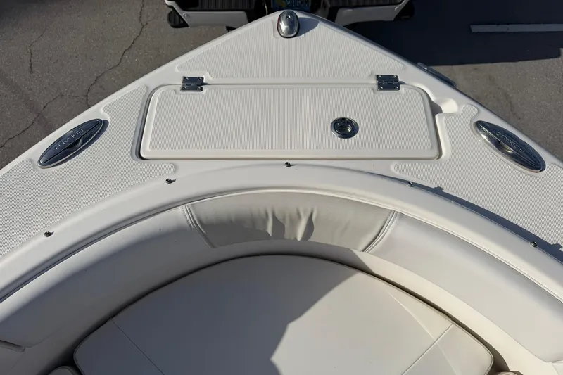 Slide: The Image of 2016 Robalo R227 Dual Console boat bow with seating and storage compartment. - 20