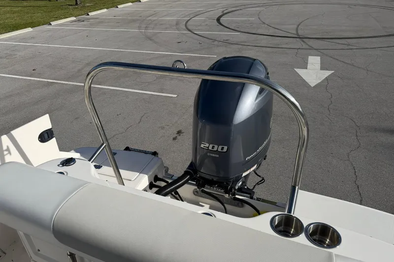 Slide: The Image of 2016 Robalo R227 Dual Console with Yamaha 200 engine in parking lot. - 25
