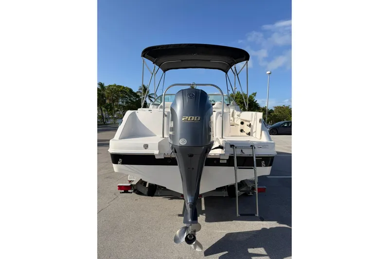 Slide: The Image of 2016 Robalo R227 Dual Console boat with Yamaha 200 outboard motor, parked outdoors. - 4