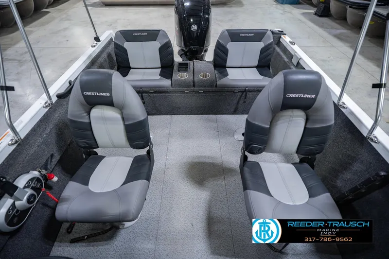 Slide: The Image of 2014 Crestliner 1650 Fish Hawk SE interior with four seats and steering console. - 20