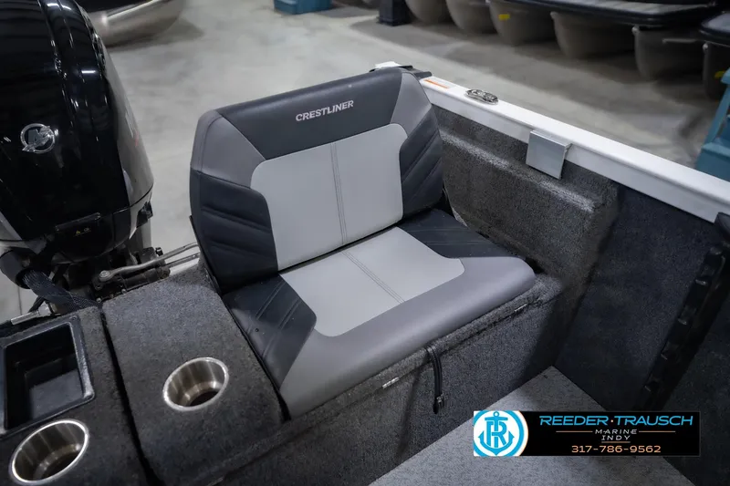 Slide: The Image of 2014 Crestliner 1650 Fish Hawk SE boat seat with cup holders and motor. - 22