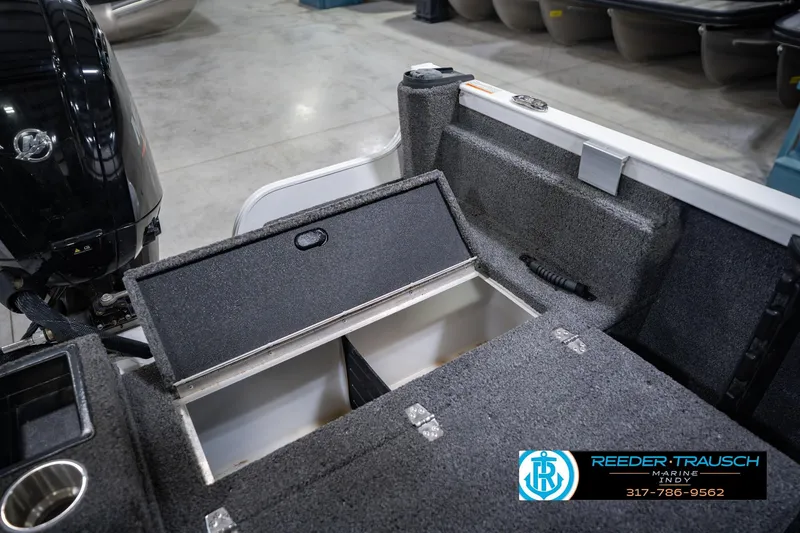 Slide: The Image of 2014 Crestliner 1650 Fish Hawk SE boat interior with open storage compartment. - 25