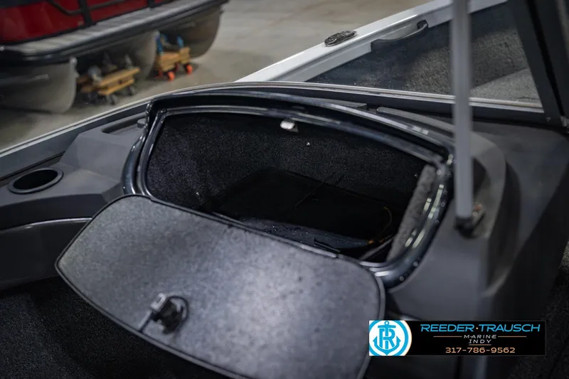 Slide: The Image of Open storage compartment in a 2014 Crestliner 1650 Fish Hawk SE boat. - 27