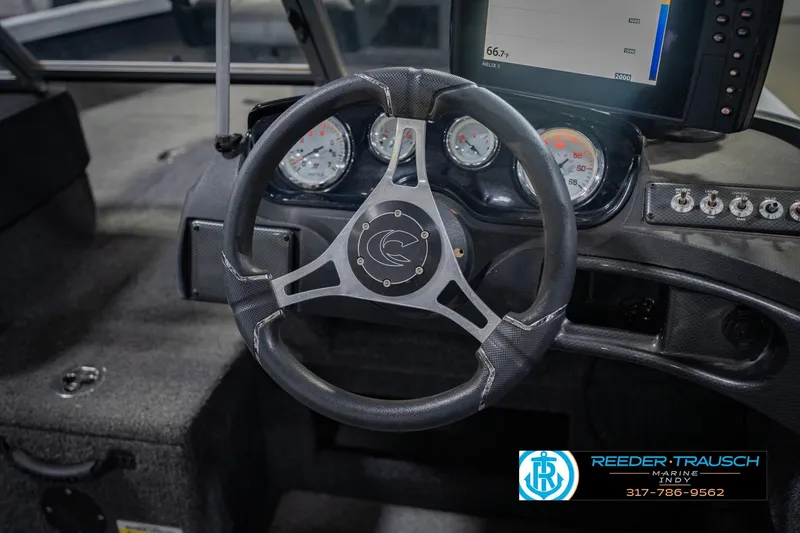 Slide: The Image of Steering wheel and dashboard of 2014 Crestliner 1650 Fish Hawk SE boat. - 30