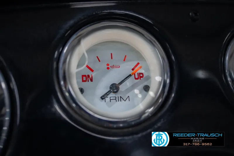 Slide: The Image of Trim gauge on 2014 Crestliner 1650 Fish Hawk SE dashboard, showing "UP" and "DN" indicators. - 34