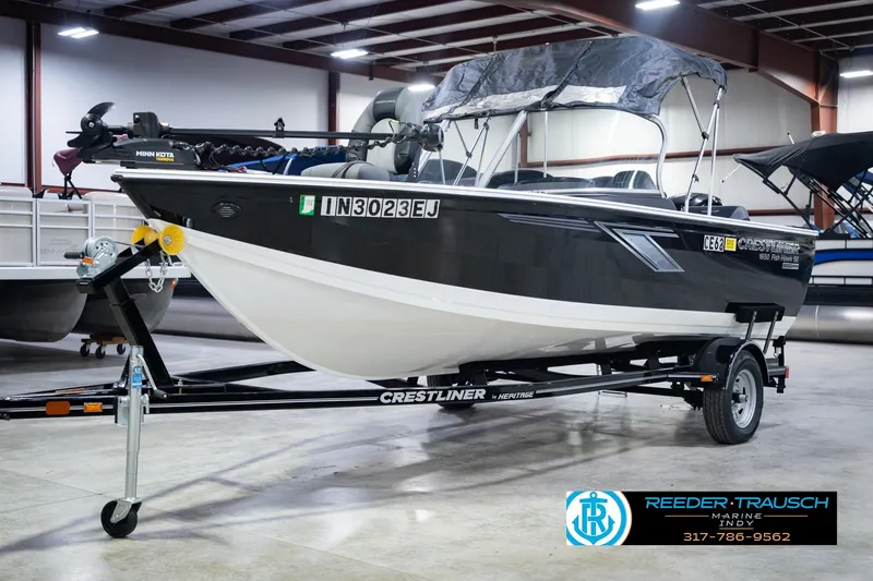 Slide: The Image of 2014 Crestliner 1650 Fish Hawk SE boat on trailer in indoor showroom. - 4