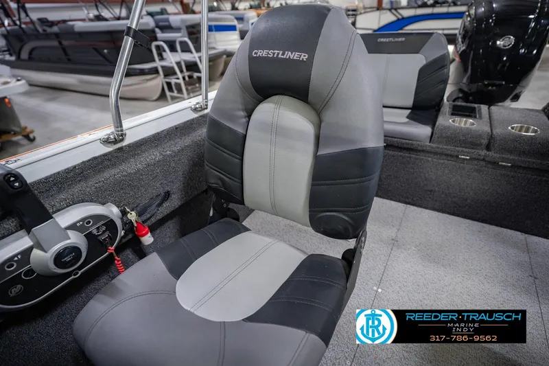 Slide: The Image of 2014 Crestliner 1650 Fish Hawk SE boat interior with seating and control panel. - 40