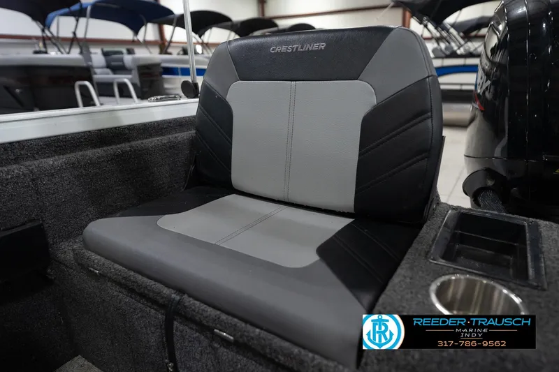 Slide: The Image of 2014 Crestliner 1650 Fish Hawk SE boat seat with cup holder in showroom. - 42