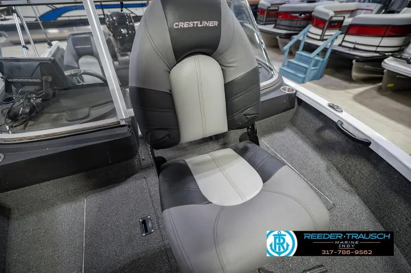 Slide: The Image of 2014 Crestliner 1650 Fish Hawk SE boat interior with cushioned seat and control panel. - 43
