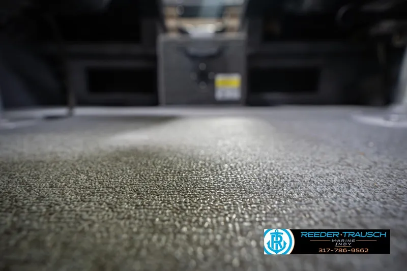 Slide: The Image of 2014 Crestliner 1650 Fish Hawk SE boat interior with textured flooring, Reeder Trausch Marine logo. - 46