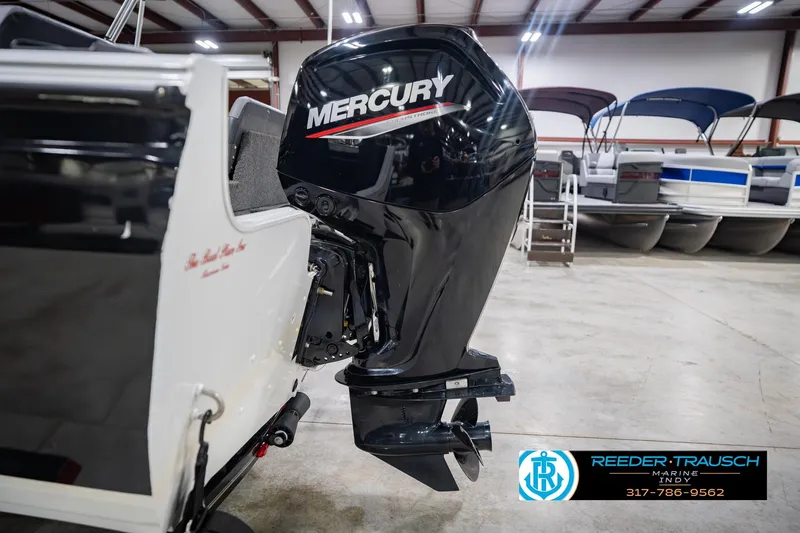 Slide: The Image of 2014 Crestliner 1650 Fish Hawk SE with Mercury outboard motor in showroom. - 47