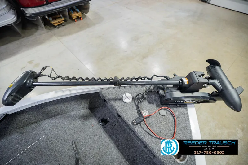 Slide: The Image of Minn Kota trolling motor on 2014 Crestliner 1650 Fish Hawk SE boat, in a garage setting. - 52