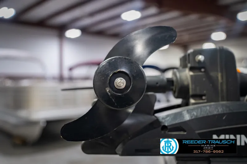 Slide: The Image of Close-up of a 2014 Crestliner 1650 Fish Hawk SE boat propeller in a showroom. - 55