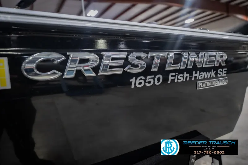 Slide: The Image of 2014 Crestliner 1650 Fish Hawk SE boat, Platinum Edition, close-up of logo. - 56