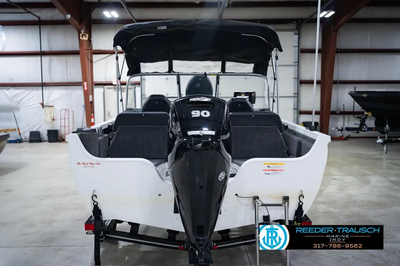 Slide: The Image of 2014 Crestliner 1650 Fish Hawk SE boat with Mercury 90 engine in a showroom. - 9