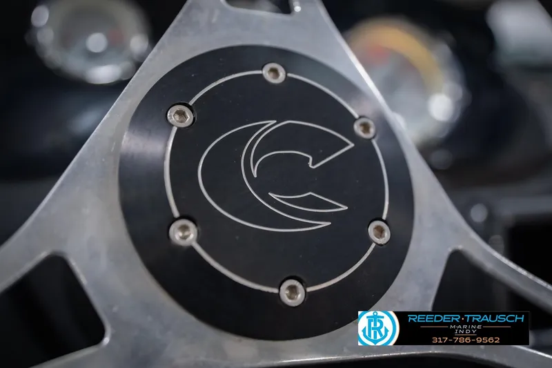 Slide: The Image of Close-up of Crestliner 1650 Fish Hawk SE steering wheel, 2014 model, featuring logo detail. - 32