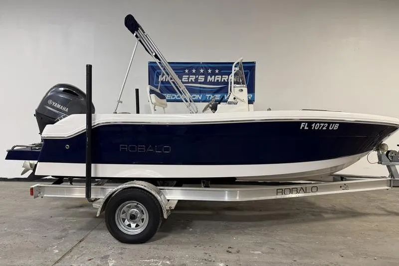 The Image of 2025 Robalo R160 Center Console boat on trailer, featuring Yamaha engine. - 0