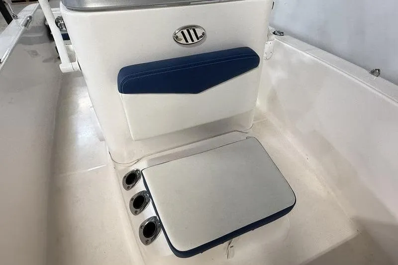 Slide: The Image of 2025 Robalo R160 Center Console boat interior with blue and white seating. - 11