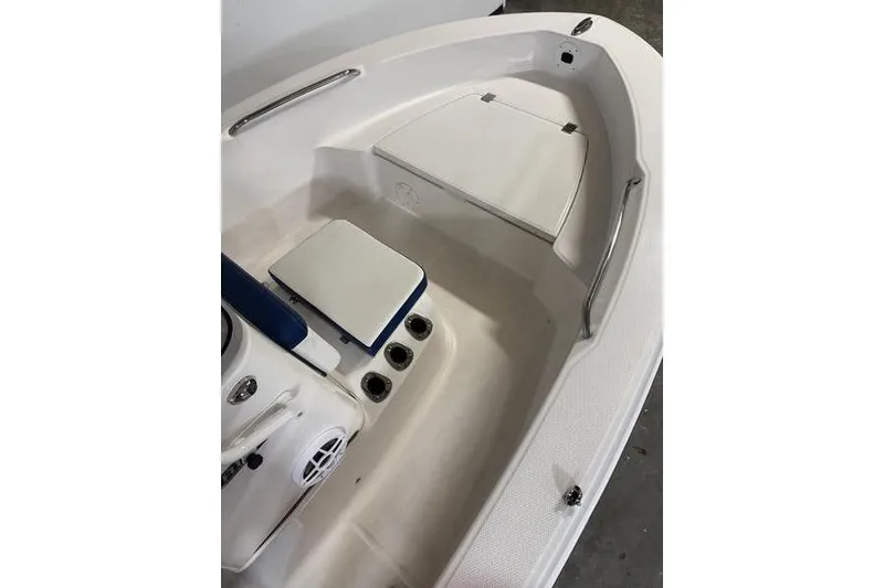 Slide: The Image of 2025 Robalo R160 Center Console boat interior with seating and storage. - 12