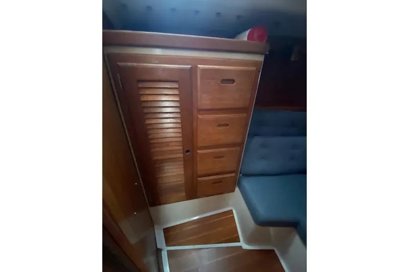 Slide: The Image of Wooden cabinetry and seating inside a 1998 Catalina 36 MkII sailboat interior. - 14