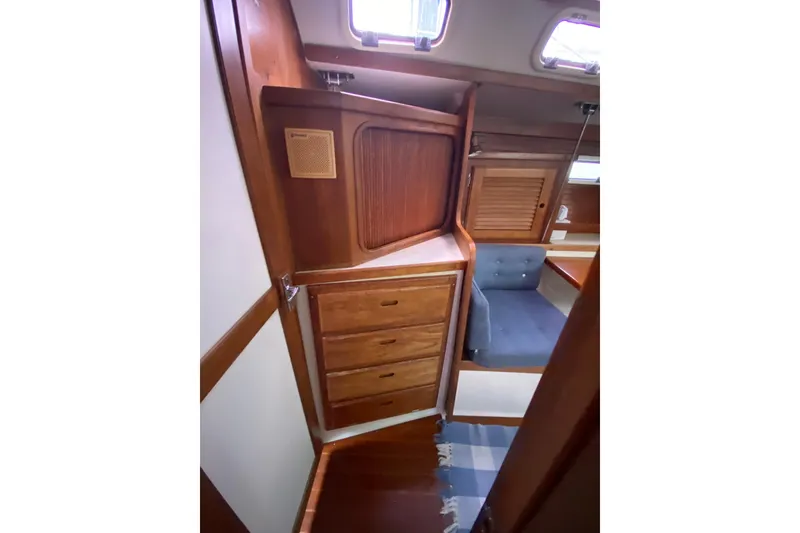 Slide: The Image of Interior of 1998 Catalina 36 MkII sailboat with wooden cabinetry and seating area. - 16