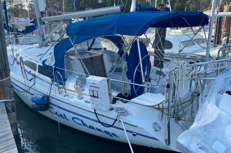 Slide: The Image of Catalina 36 MkII sailboat, 1998 model, docked with blue canopy and lifebuoy. - 2