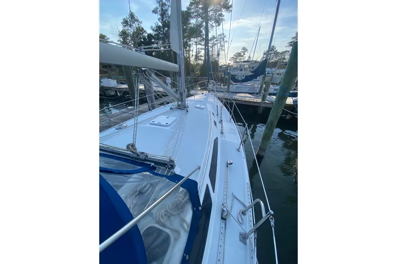 Slide: The Image of 1998 Catalina 36 MkII sailboat docked, showcasing sleek deck design and rigging. - 3