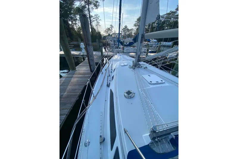 Slide: The Image of 1998 Catalina 36 MkII sailboat docked at marina, showcasing deck and rigging. - 4