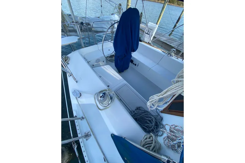 Slide: The Image of Cockpit of a 1998 Catalina 36 MkII sailboat with ropes and covered wheel. - 5