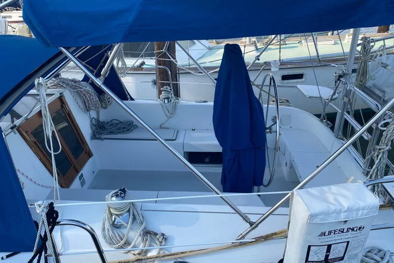 Slide: The Image of Cockpit of a 1998 Catalina 36 MkII sailboat with blue canvas covers and ropes. - 6